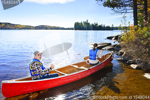 Image of Canoeing near lake shore