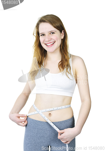 Image of Happy young girl measuring her waist