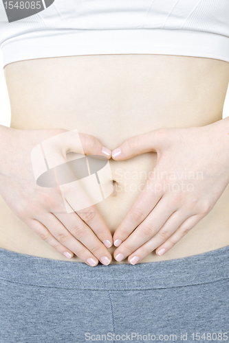 Image of Heart shaped hands on tummy