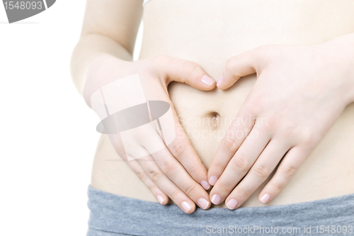 Image of Heart shaped hands on tummy