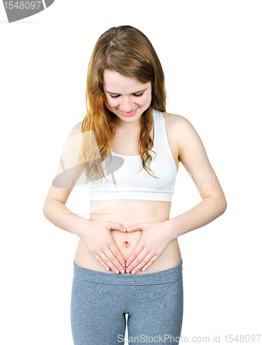 Image of Teenage girl with hands on tummy