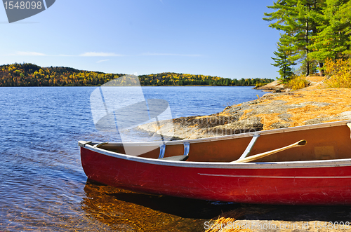 Image of Red canoe on shore