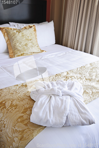 Image of Hotel bed with bathrobe