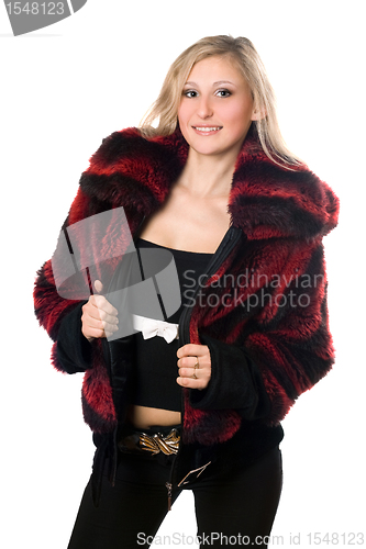 Image of Young sexy blond woman in a fur jacket