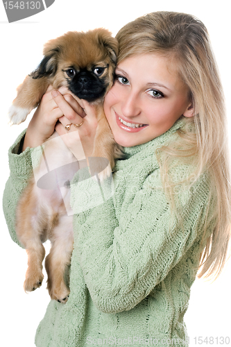 Image of Young blonde with a puppy