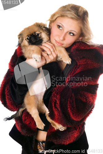 Image of Beautiful blonde holding a pekinese