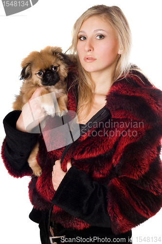 Image of Attractive woman holding a pekinese