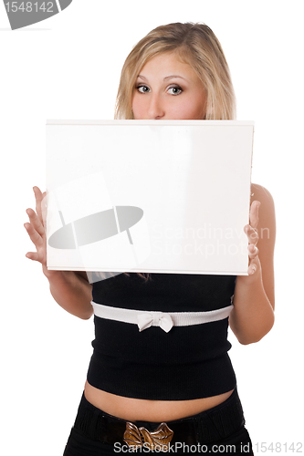 Image of Surprised woman holding white board