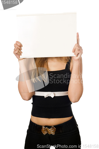 Image of Woman covering her face with white board