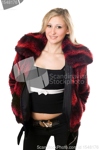 Image of Smiling young blond woman in a fur jacket
