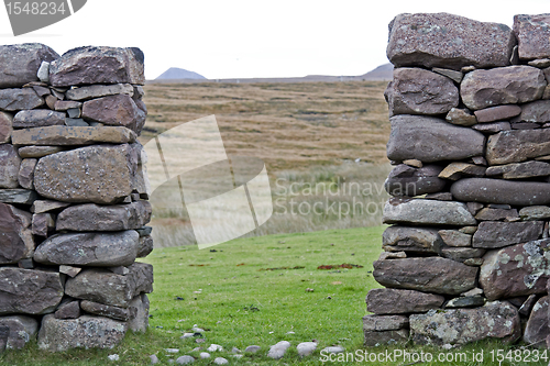 Image of passage through stone wall