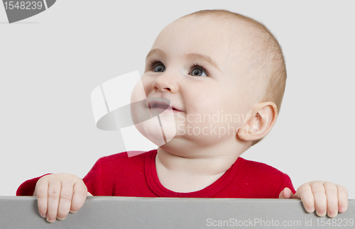 Image of young child holding sign