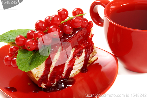 Image of Crepe cake and a red cup of tea.