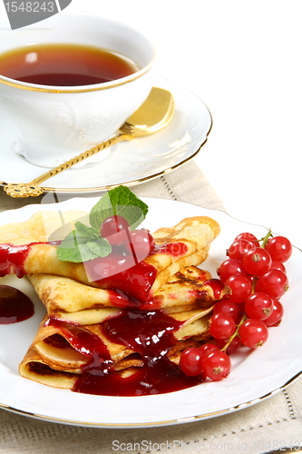 Image of Pancakes with berry sauce.