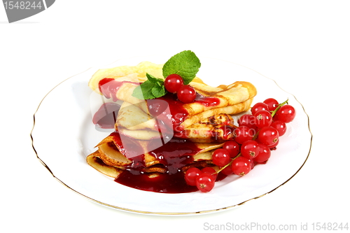 Image of Pancakes with berry sauce.