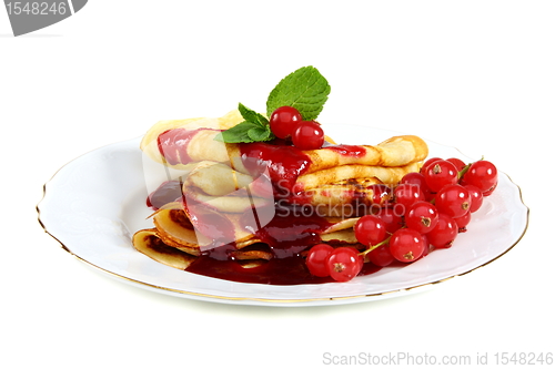 Image of Pancakes with berry sauce.