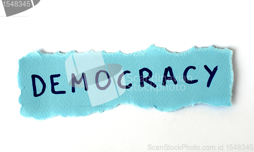 Image of The word Democracy on blue paper