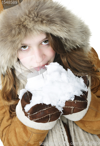 Image of Playful winter girl holding snow