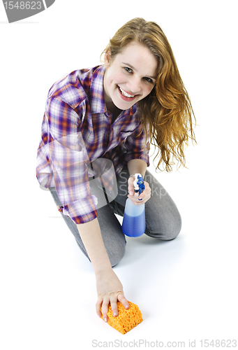 Image of Young woman washing floor