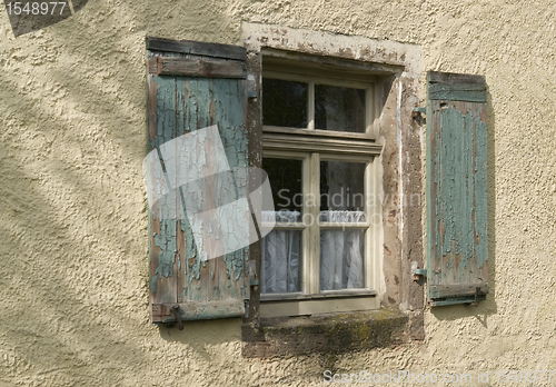 Image of old window in plastered wall