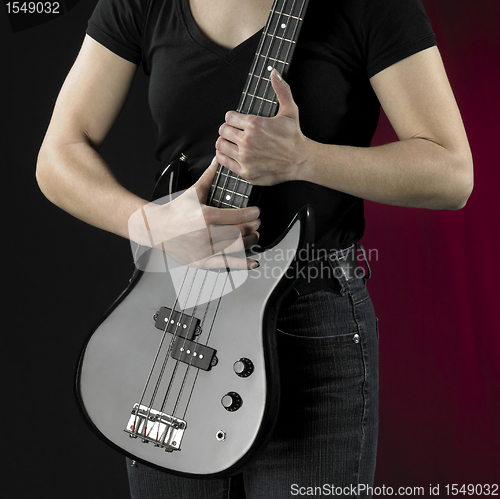 Image of woman with bass guitar