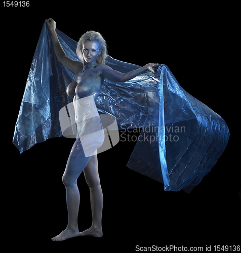 Image of blue bodypainted woman and fabrics