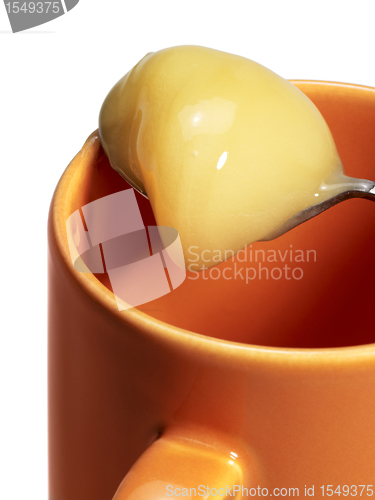 Image of cup and honey spoon