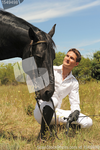 Image of young man and horse