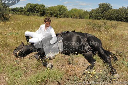 Image of young man and horse