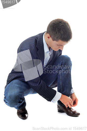 Image of business man lace up