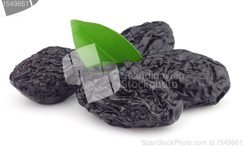 Image of Dried prunes with leaves