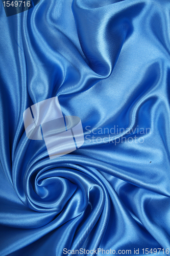 Image of Smooth elegant blue silk as background 