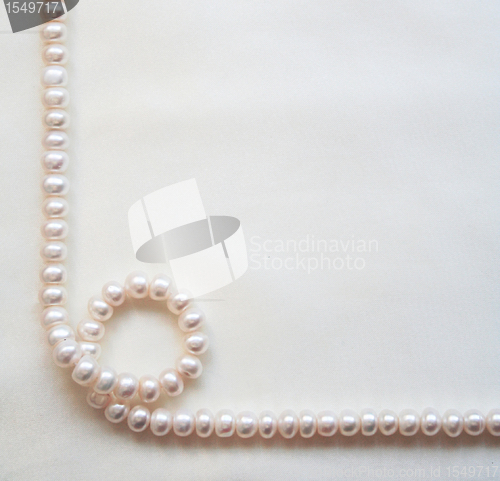 Image of Smooth elegant white silk with pearls as wedding background 