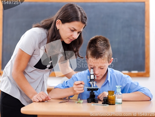 Image of Boy looking into microscope