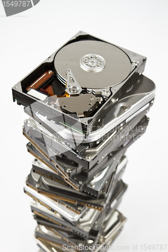 Image of Stack of hard drive with opened one on top