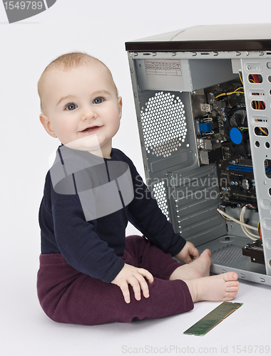 Image of young child with open computer