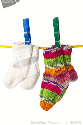 Image of four socks on a clothesline