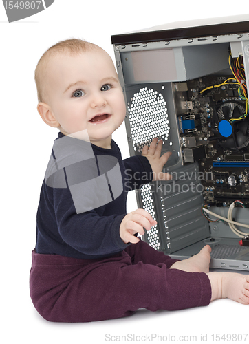 Image of young child with open computer