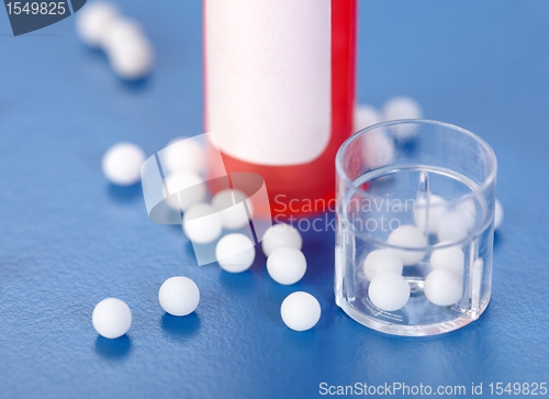 Image of Homeopathic pills and plastic containers