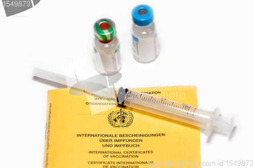 Image of certificates of vaccination booklet and syringe