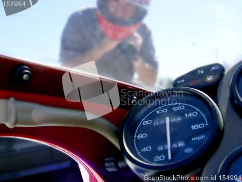 Image of Man on the red bike