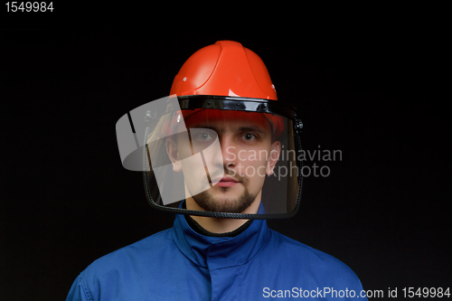 Image of The worker in overalls