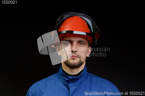 Image of The worker in overalls