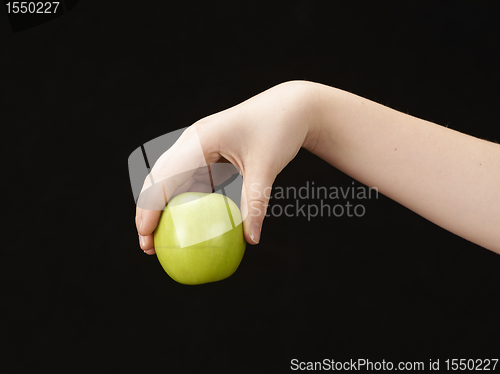 Image of Childs hand with apple