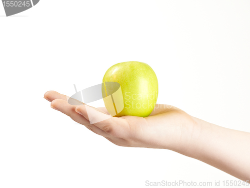 Image of Apple in the palm og childs hand