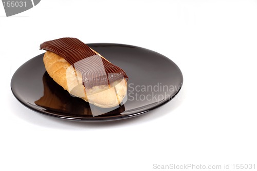 Image of Chocolate eclair on black plate
