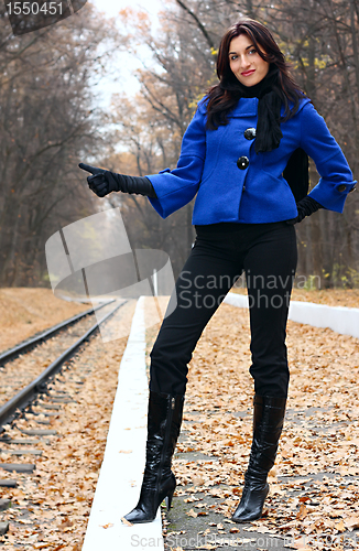 Image of Young woman hitchhiking