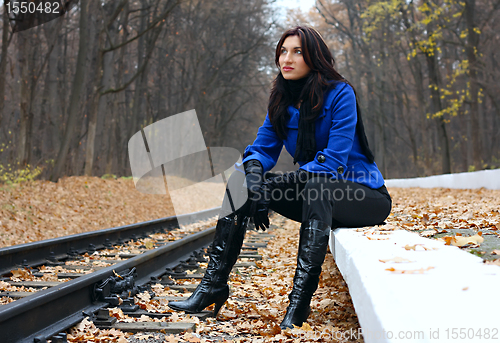 Image of Young woman near the rails
