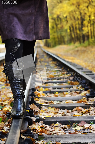 Image of Women walking on rails