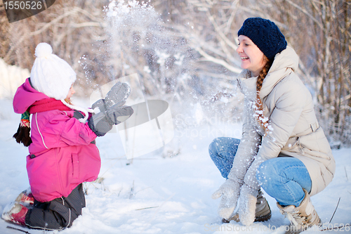 Image of Mother and daughter outdoors at winter